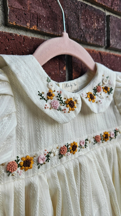 “Ivory baby dress with hand-embroidered sunflowers, roses, and puff sleeves – Rui.cares”