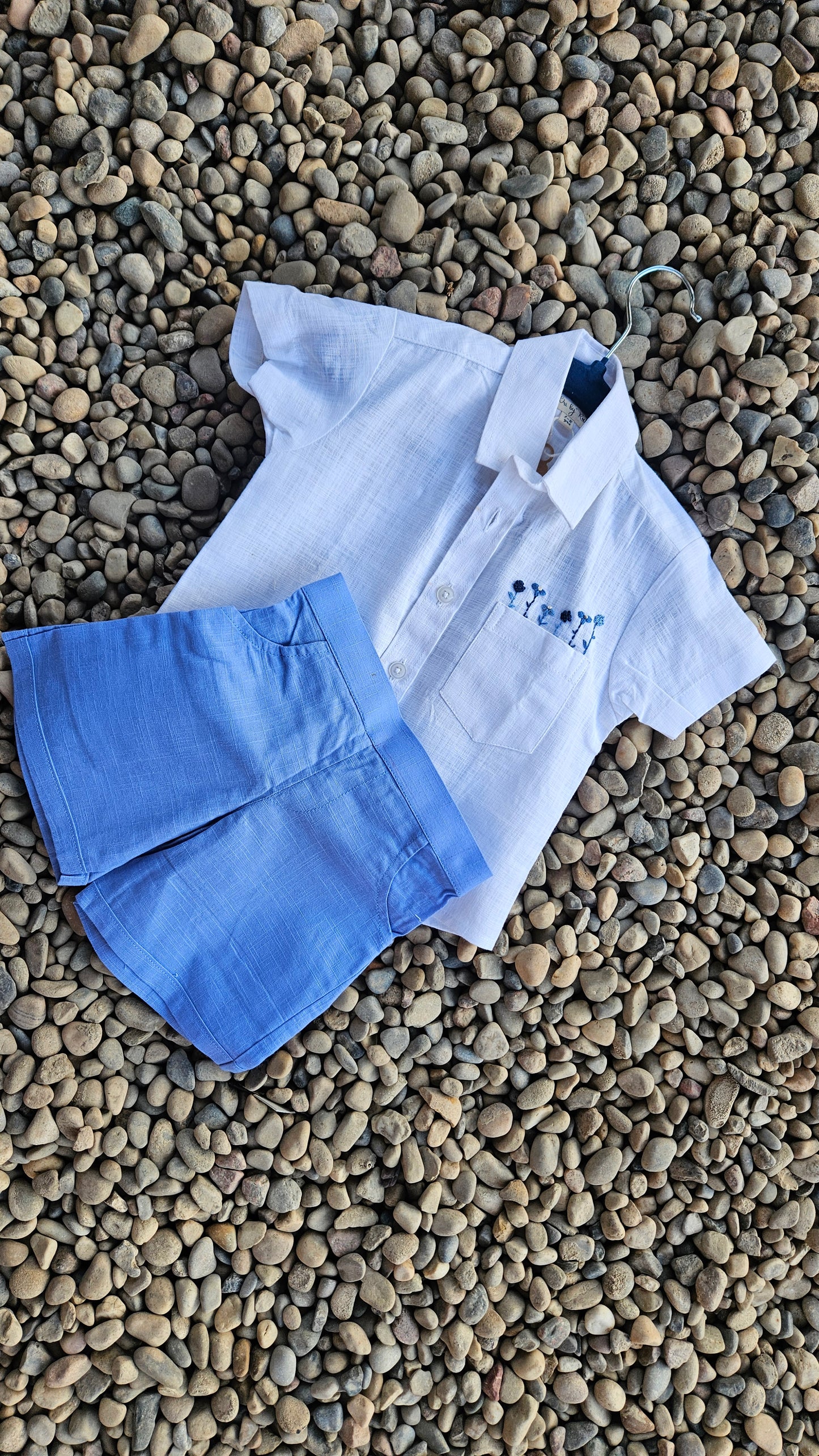 Flatlay of Summer Salt co-ord set on pebbled background.