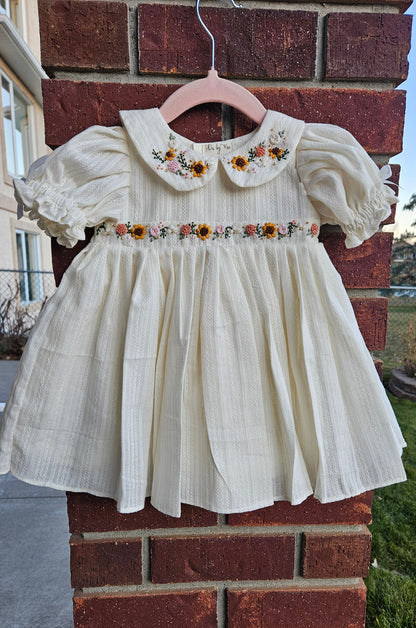 “Ivory baby dress with hand-embroidered sunflowers, roses, and puff sleeves – Rui.cares”